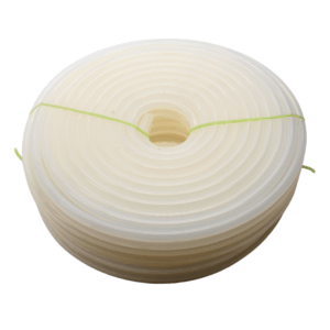 Angled view of a large clear coil of silicone tubing available from Silclear Silicone Solutions, secured with green silicone ties.